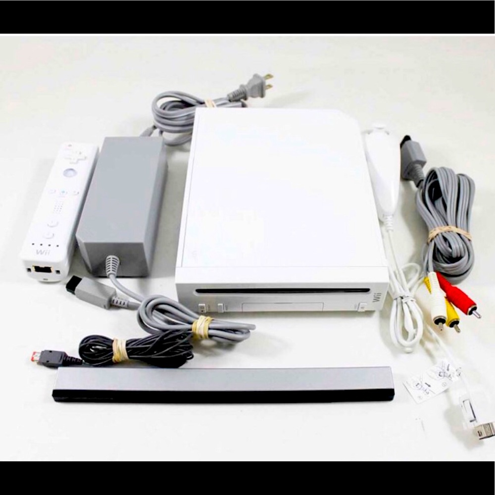 Nintendo Wii Console w/games, fit board, remotes & accessories.
